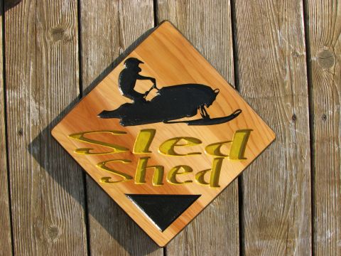 Wood sign the Sled Shed ski doo